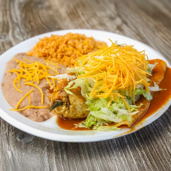 Roberto's Taco Shop's Mexican combo plate with chile relleno, enchilada, rice, and refried beans.