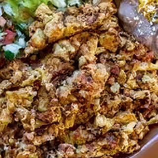 CHORIZO TORTA - BEANS, CHEESE, GUACAMOLE, LETTUCE, CHORIZO, EGGS