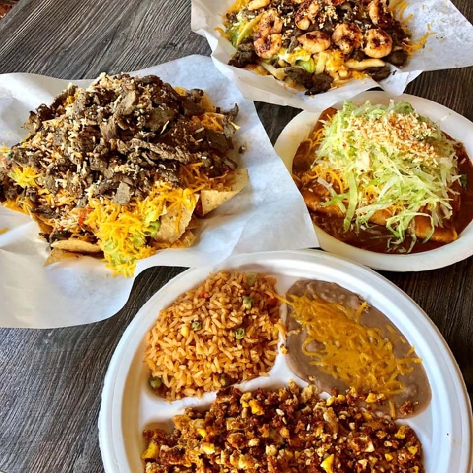 Roberto's Taco Shop's carne asada nachos, shrimp nachos, enchiladas, and a combo plate with rice and beans.