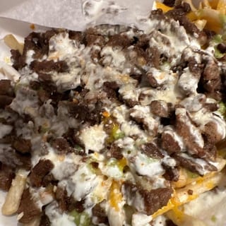 CARNE ASADA FRIES - CHEESE, CARNE ASADA, GUACAMOLE, SOUR CREAM, QUESO