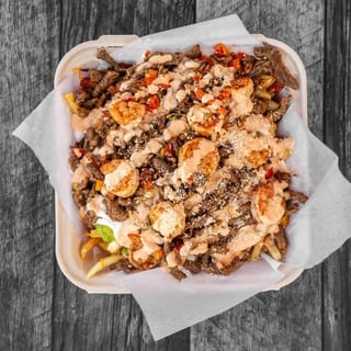 SURF & TURF FRIES - CHEESE, ASADA, SHRIMP ,GUAC, SOUR CREAM, QUESO